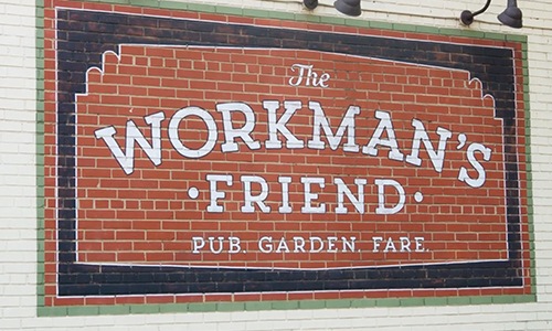 brick wall with a sign on it